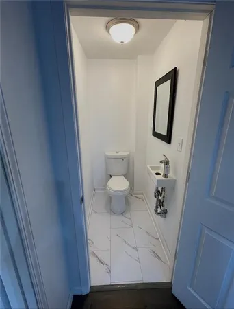 a bathroom with a toilet and a sink