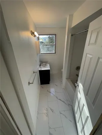 a bathroom with a sink and toilet