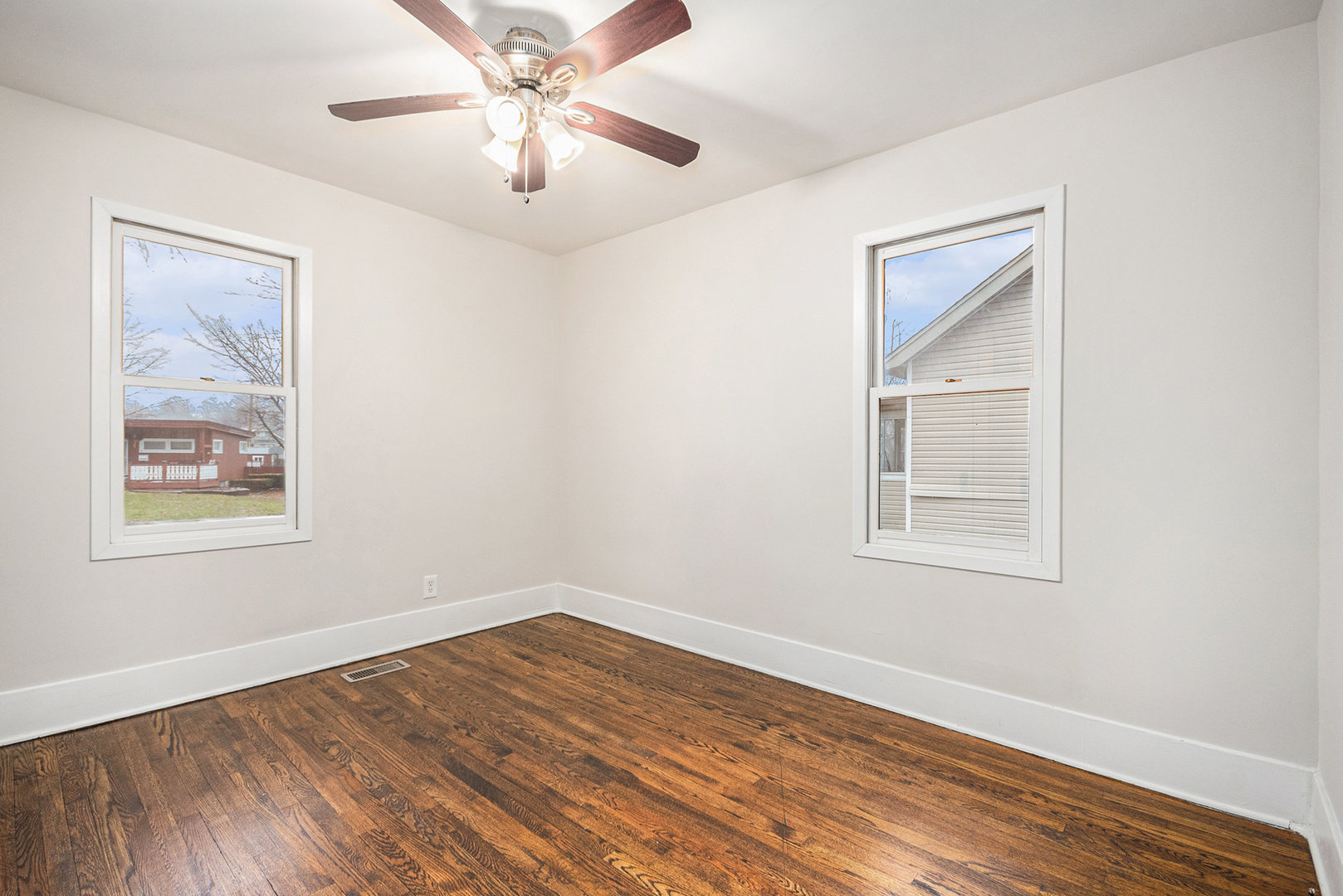 247 North West Road Lombard, IL 60148 - Photo 14 of 25 a view of empty room with wooden floor and fan