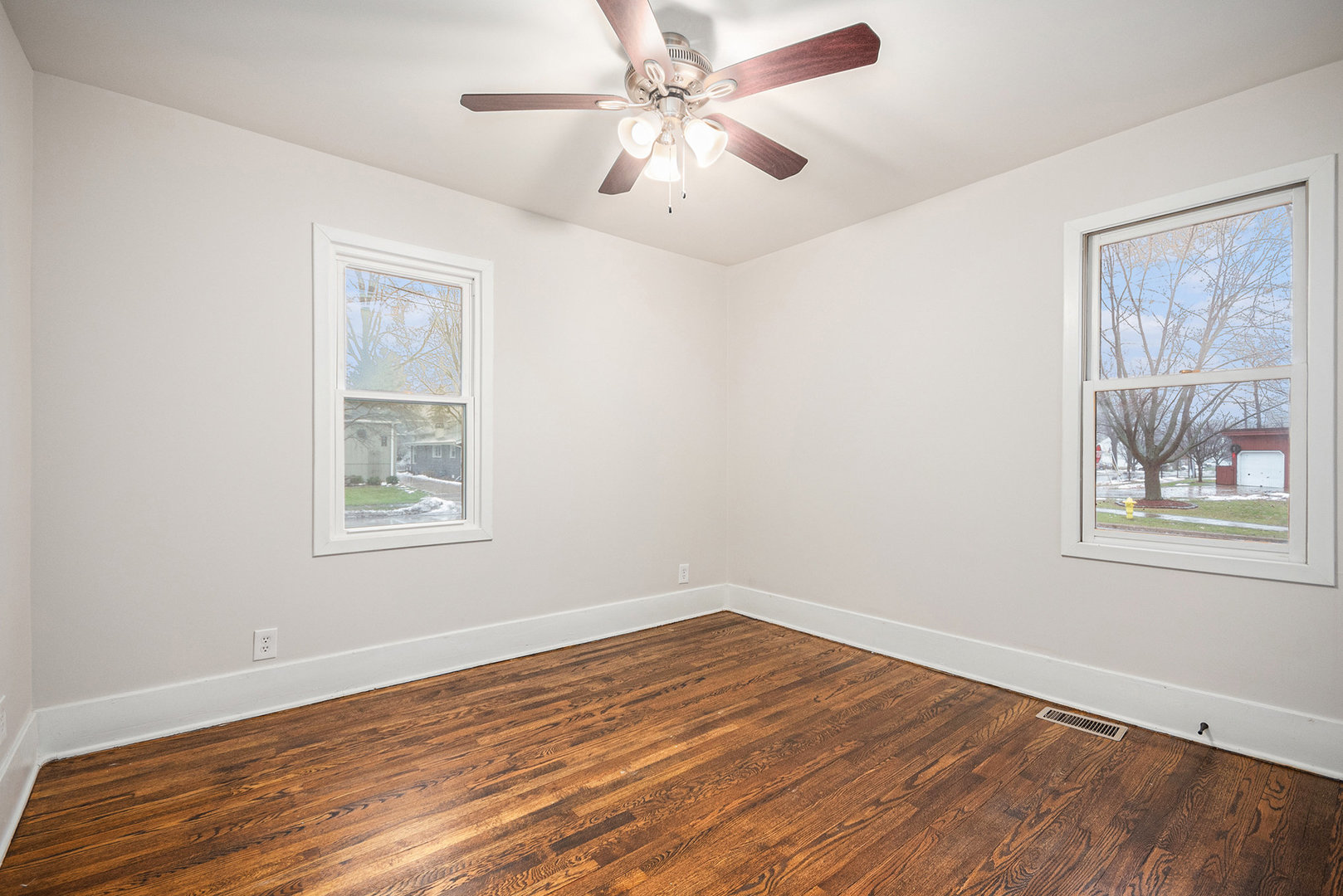 247 North West Road Lombard, IL 60148 - Photo 15 of 25 a view of empty room with wooden floor and fan