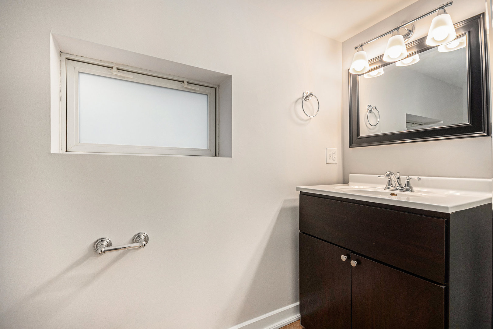 247 North West Road Lombard, IL 60148 - Photo 16 of 25 a bathroom with a sink vanity and mirror