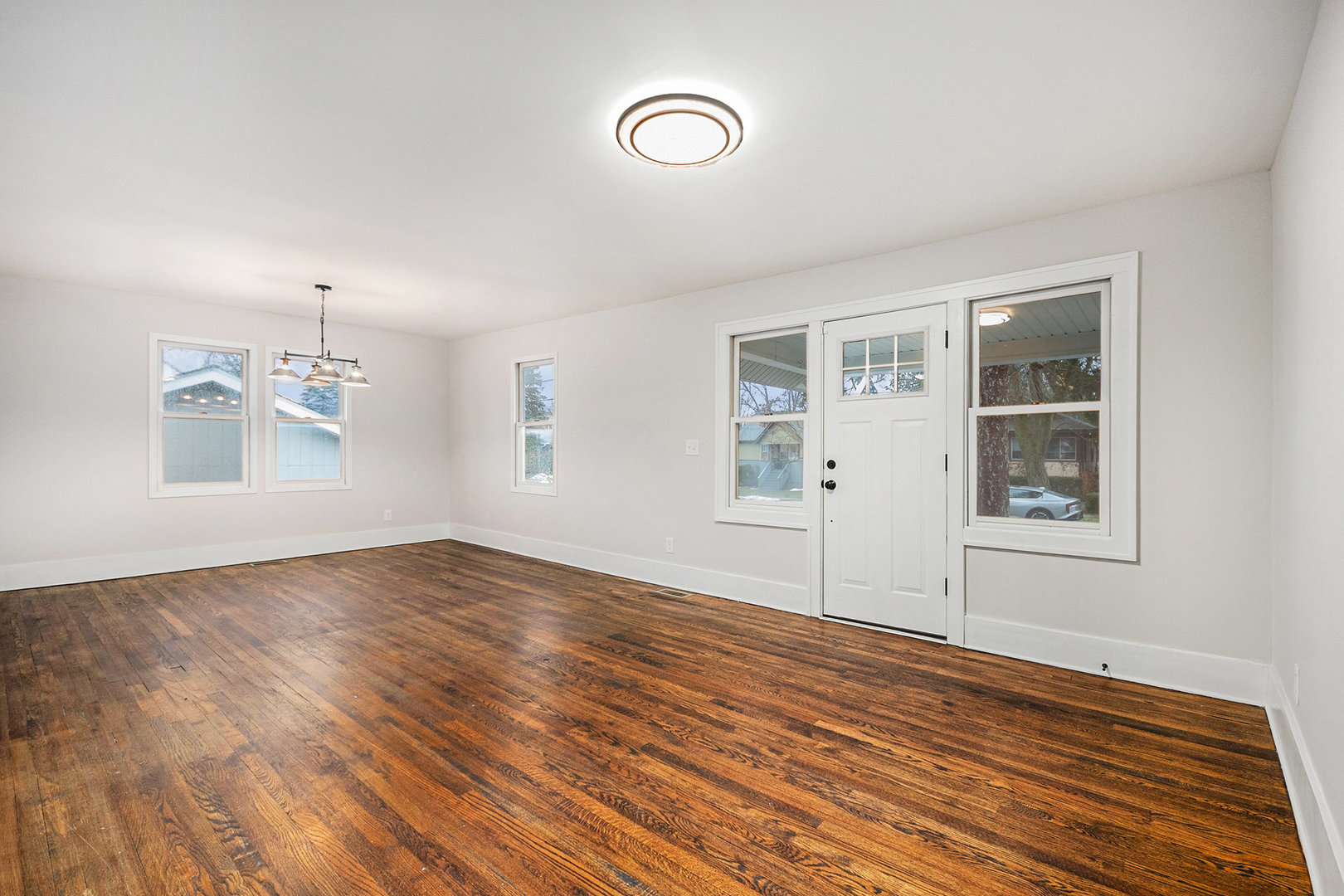 247 North West Road Lombard, IL 60148 - Photo 2 of 25 a view of empty room with wooden floor and fan