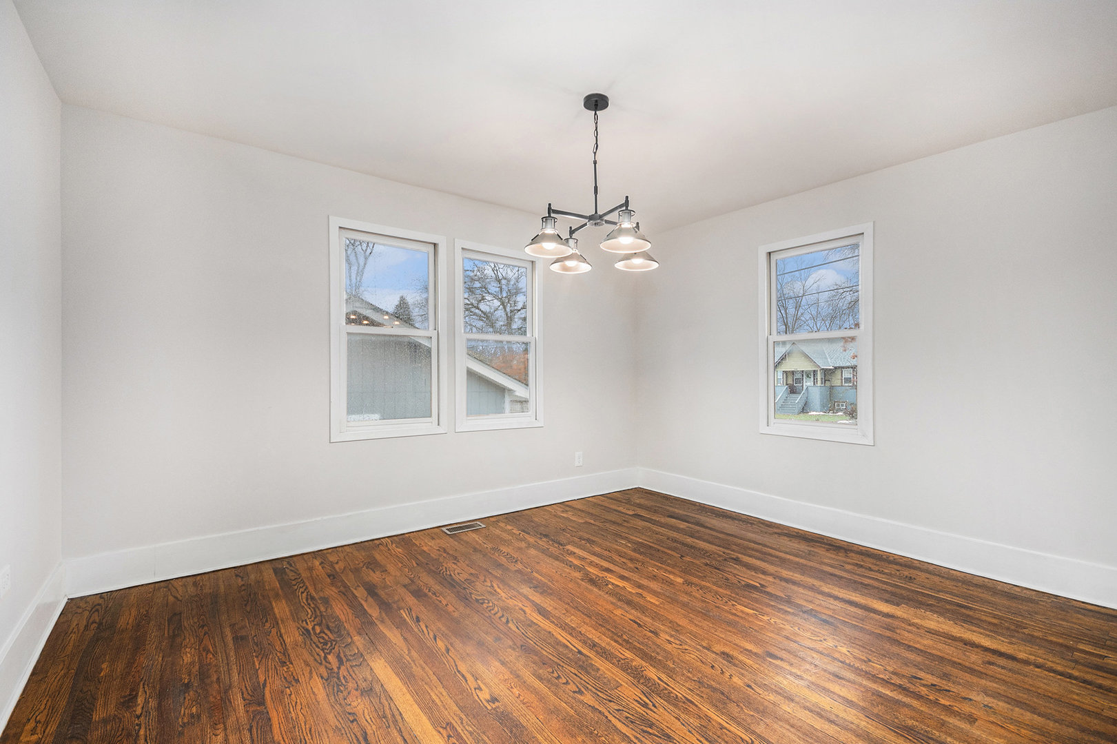 247 North West Road Lombard, IL 60148 - Photo 5 of 25 a view of empty room with window and wooden floor