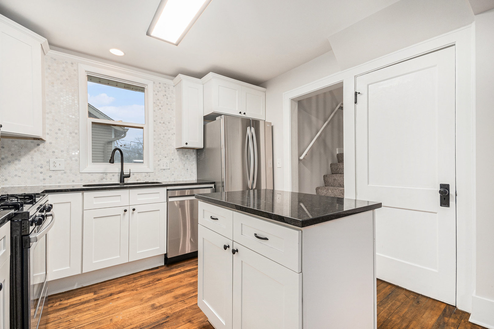 247 North West Road Lombard, IL 60148 - Photo 8 of 25 a kitchen with white cabinets and stainless steel appliances