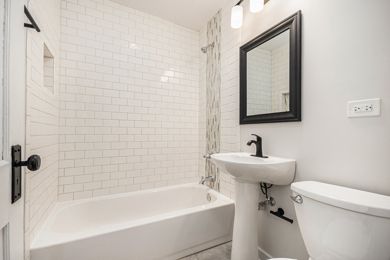 247 North West Road Lombard, IL 60148 - Photo 10 of 25 a bathroom with a sink a toilet and a bathtub