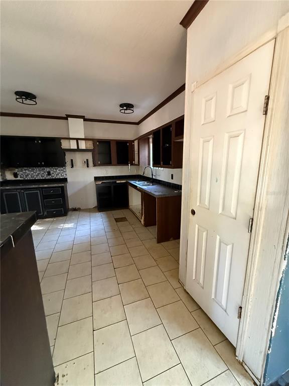 132 Pond Side Trail Hawthorne, FL 32640 - Photo 19 of 31 a kitchen with stainless steel appliances granite countertop a stove a sink and a refrigerator