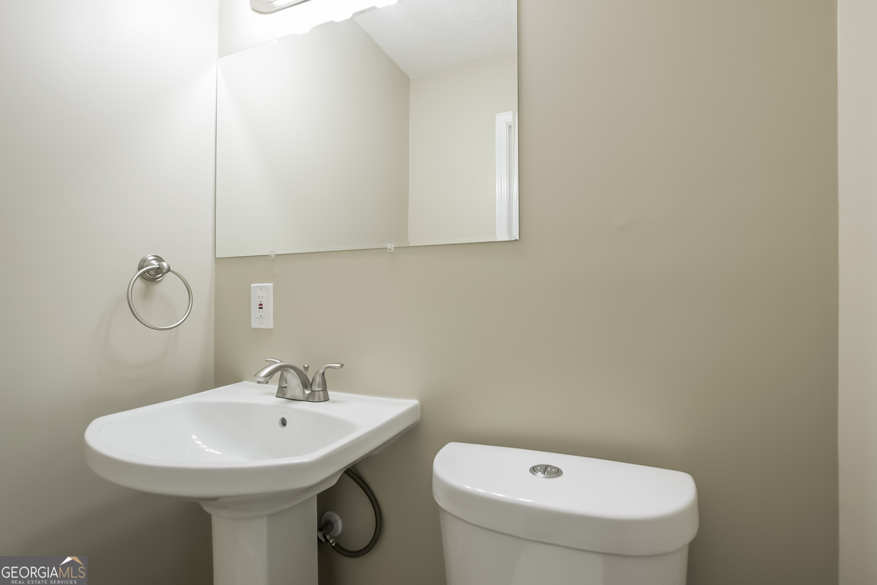 3250 Ridgecrest Drive Powder Springs, GA 30127 - Photo 13 of 15 a bathroom with a sink a toilet and mirror