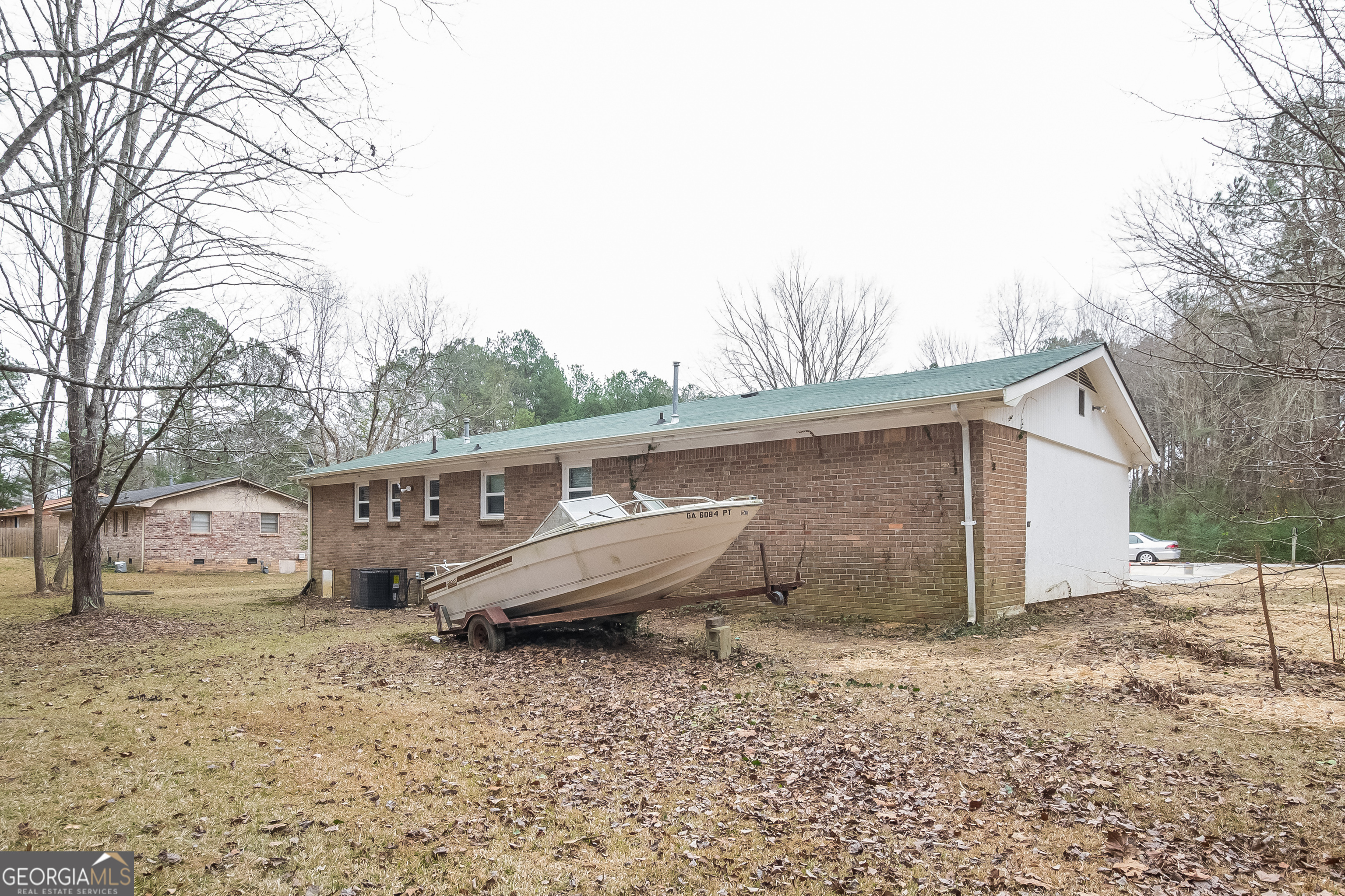 3250 Ridgecrest Drive Powder Springs, GA 30127 - Photo 14 of 15 a view of a house with backyard and trees