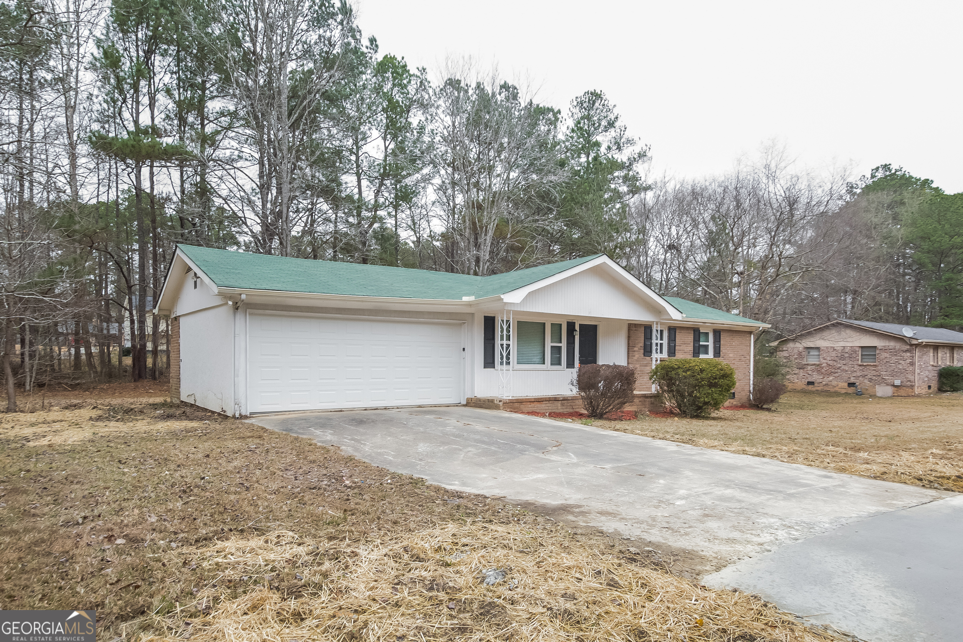 3250 Ridgecrest Drive Powder Springs, GA 30127 - Photo 2 of 15 a front view of a house with a yard and garage