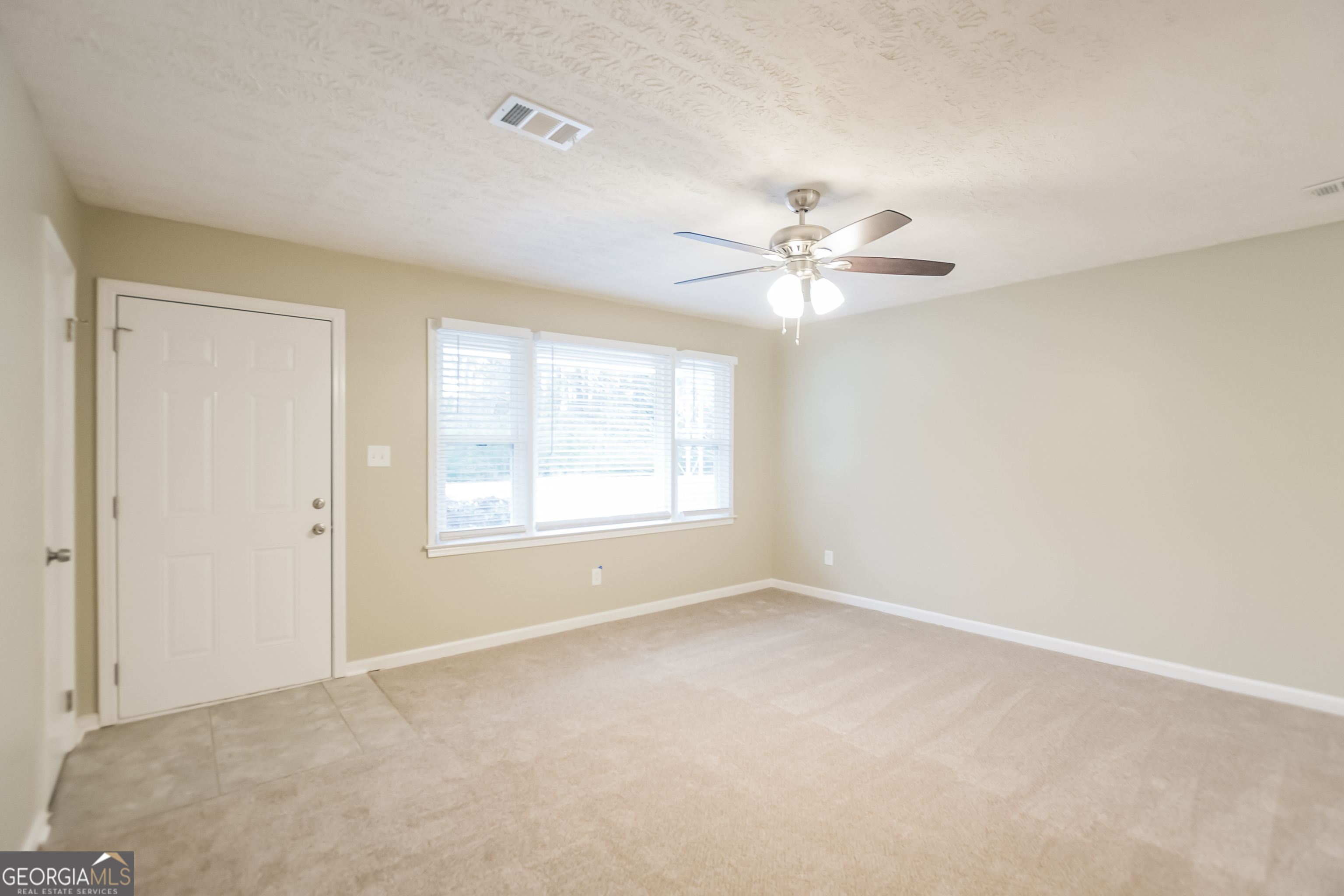 3250 Ridgecrest Drive Powder Springs, GA 30127 - Photo 3 of 15 a view of an empty room with a window
