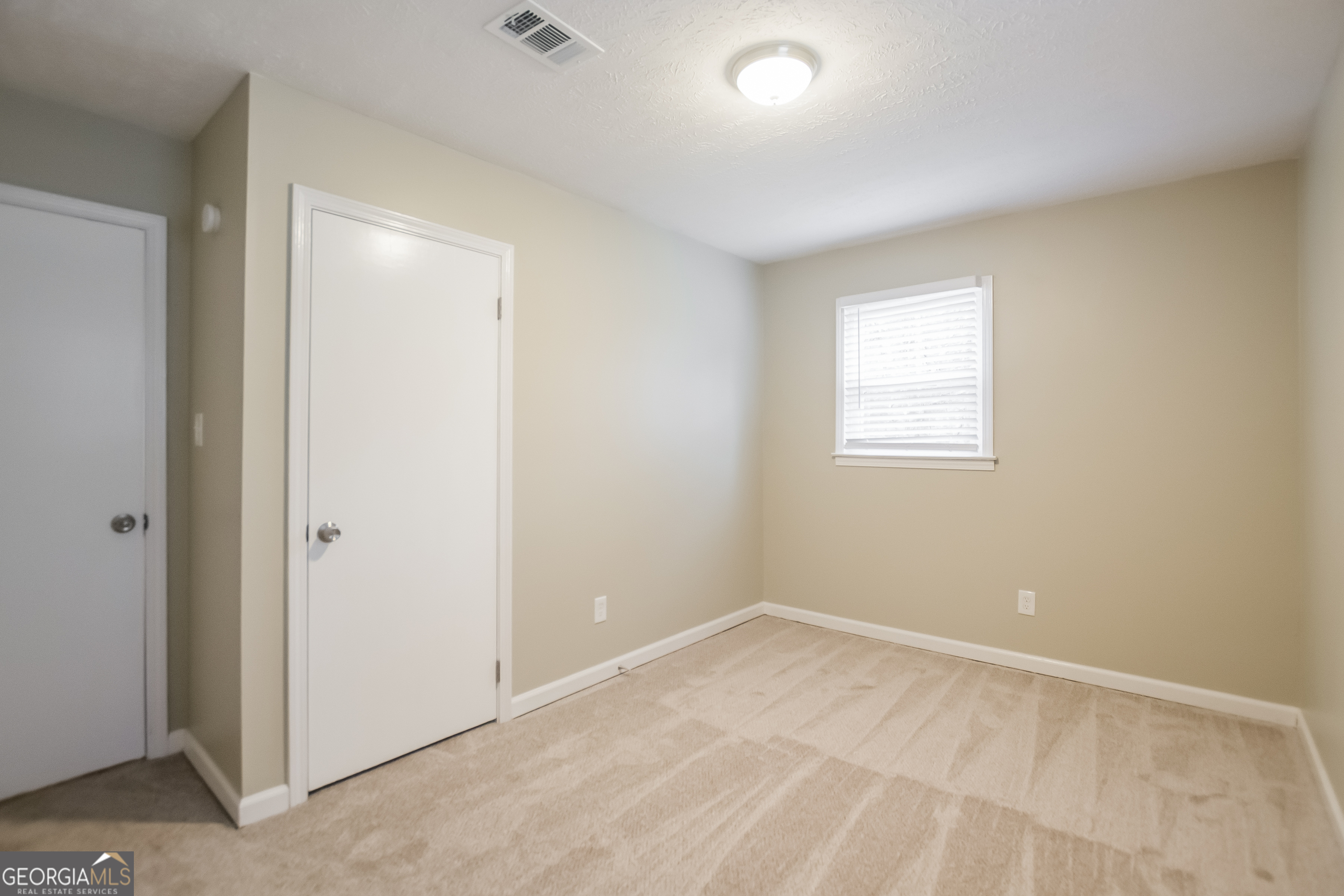 3250 Ridgecrest Drive Powder Springs, GA 30127 - Photo 9 of 15 an empty room with a window