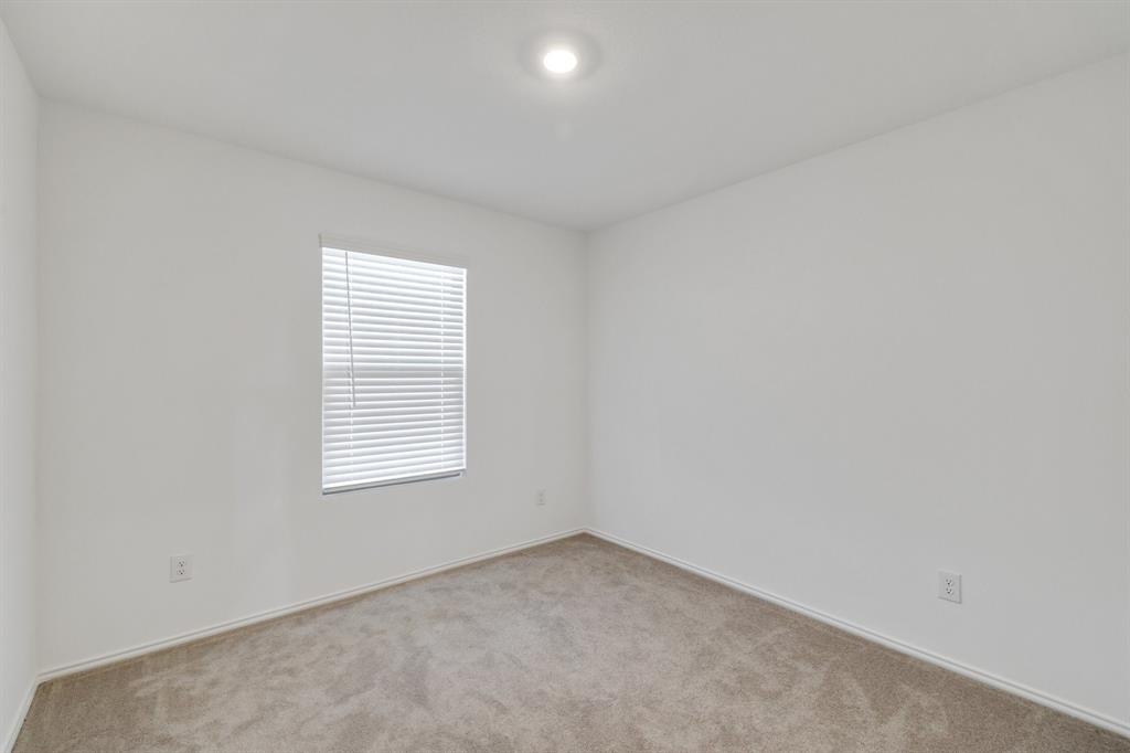2809 Ozark Circle Little Elm, TX 75068 - Photo 11 of 28 an empty room with a window