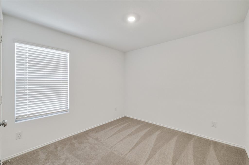 2809 Ozark Circle Little Elm, TX 75068 - Photo 14 of 28 an empty room with a window