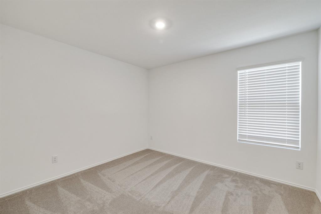 2809 Ozark Circle Little Elm, TX 75068 - Photo 16 of 28 an empty room with a window