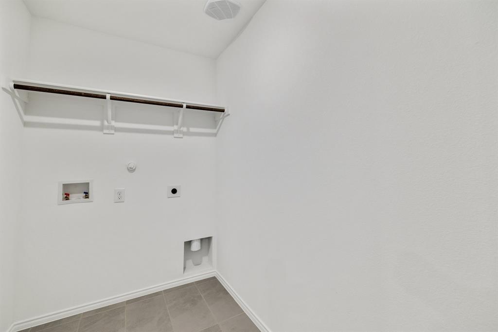 2809 Ozark Circle Little Elm, TX 75068 - Photo 18 of 28 a view of an empty walk in closet