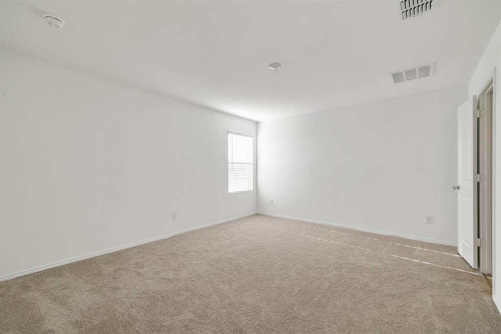 2809 Ozark Circle Little Elm, TX 75068 - Photo 20 of 28 an empty room with windows