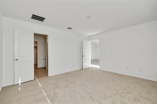 a bathroom with a granite countertop sink a mirror and a bathtub