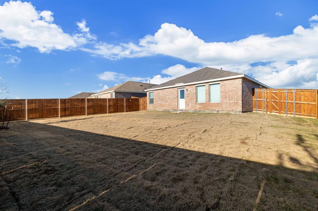 2809 Ozark Circle Little Elm, TX 75068 - Photo 27 of 28 a front view of a house with a yard