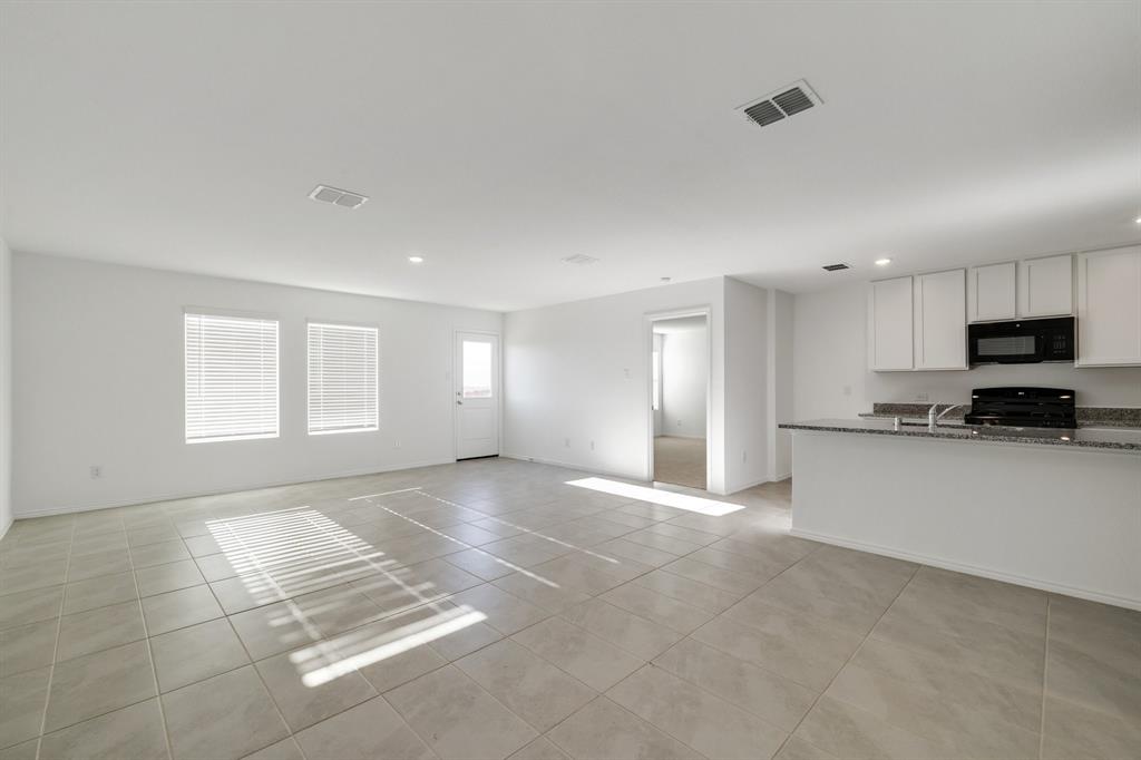 2809 Ozark Circle Little Elm, TX 75068 - Photo 8 of 28 a view of a kitchen with a sink and cabinets