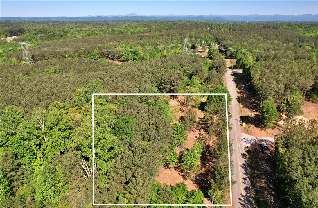 Lot 134 Mcalister Rd Union West Union, SC 29696 - Photo 35 of 43 This aerial view showcases a verdant lot nestled within a expansive forested landscape.