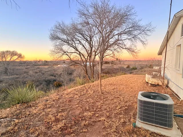 a living room with furniture fireplace and a large window