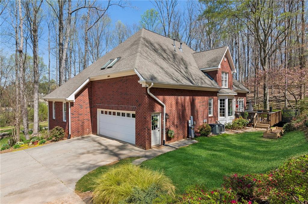 5388 Frazer Road Buford, GA 30518 - Photo 35 of 83 a view of a house with a yard and sitting area