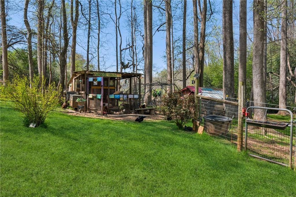 5388 Frazer Road Buford, GA 30518 - Photo 49 of 83 a view of a park with swings and slides