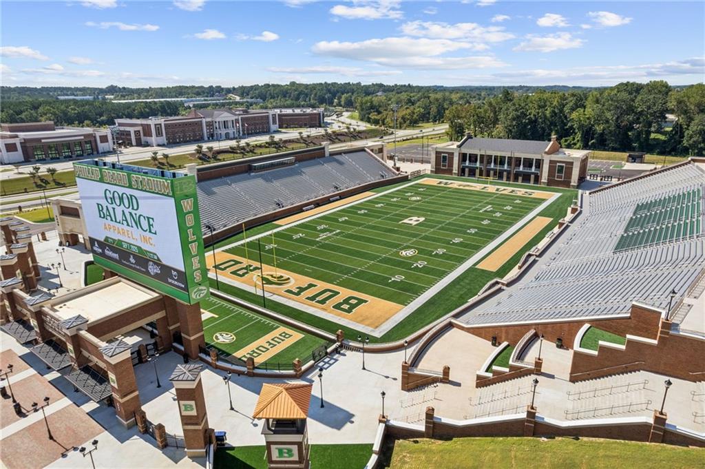 5388 Frazer Road Buford, GA 30518 - Photo 71 of 83 a view of a swimming pool with a patio and a yard