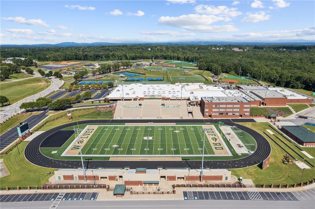 5388 Frazer Road Buford, GA 30518 - Photo 76 of 83 a view of a swimming pool with a yard
