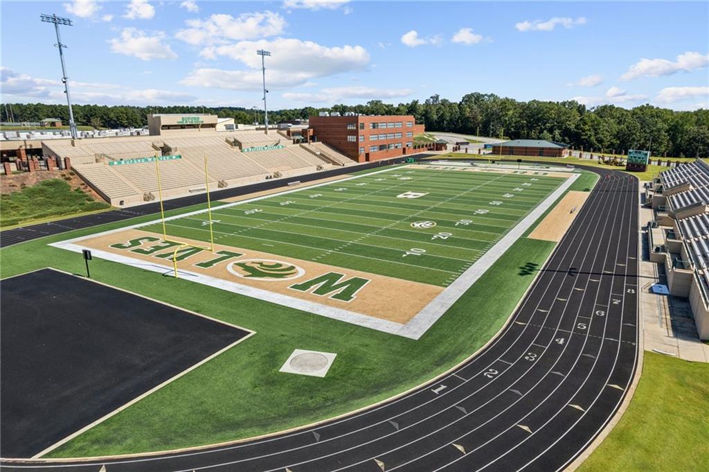 5388 Frazer Road Buford, GA 30518 - Photo 79 of 83 a view of a tennis ground with a large pool