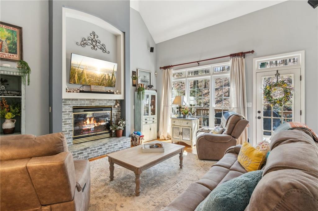 5388 Frazer Road Buford, GA 30518 - Photo 9 of 83 a living room with furniture and a fireplace