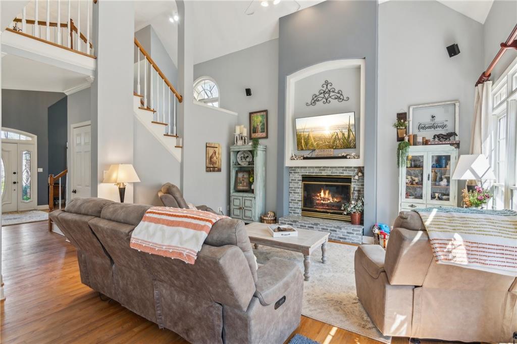 5388 Frazer Road Buford, GA 30518 - Photo 10 of 83 a living room with furniture fireplace and a flat screen tv