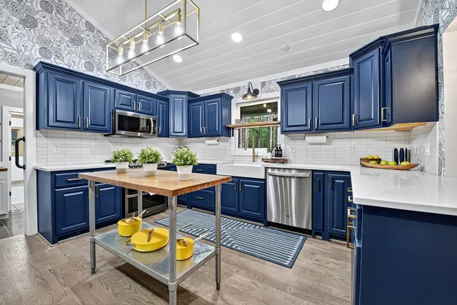 a living room with furniture a clock and a window