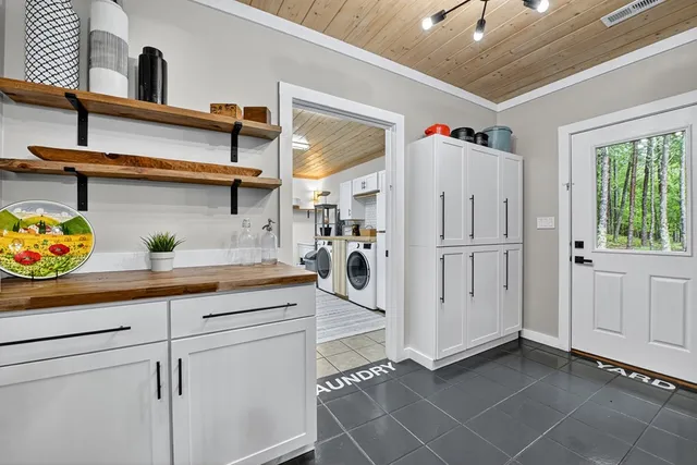 a bed room with furniture and a large window