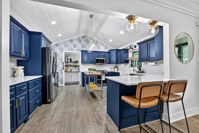 a living room with furniture fireplace and a flat screen tv