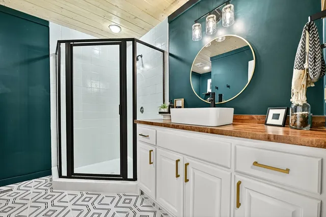 a kitchen with stainless steel appliances granite countertop a stove and cabinets
