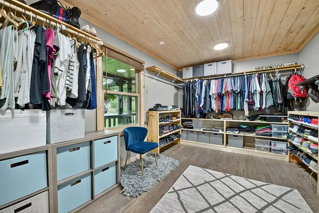 a view of a house with a yard balcony and sitting area