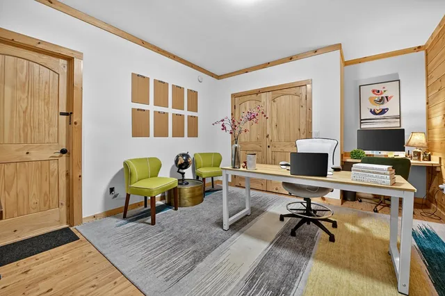 a backyard of a house with table and chairs