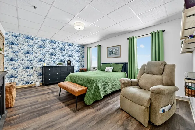 a view of a deck with couches table and chairs and garden