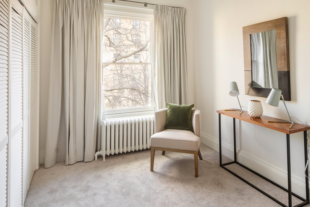 413 Beacon Street, Unit 5 Boston, MA 02115 - Photo 11 of 19 a living room with furniture and a window