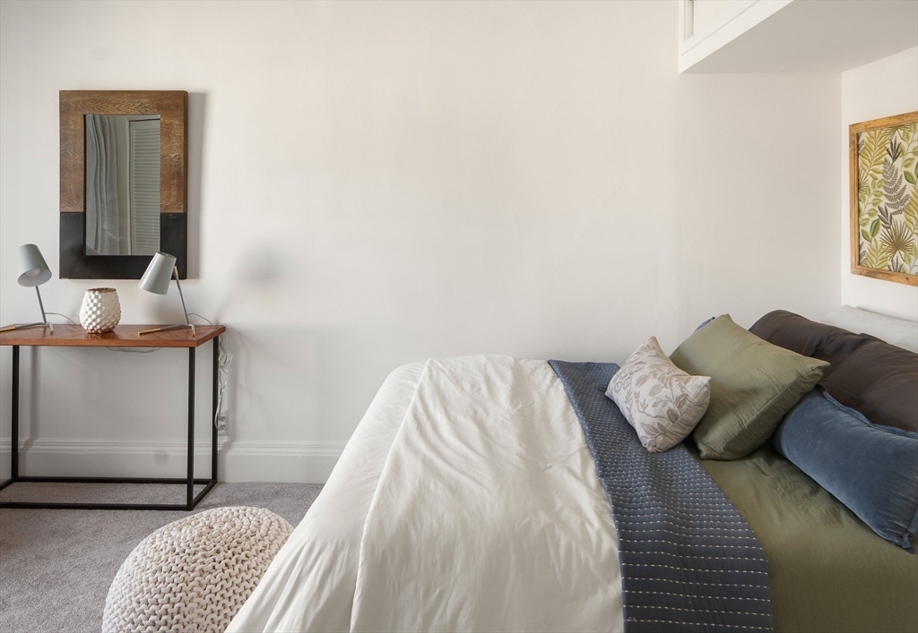 413 Beacon Street, Unit 5 Boston, MA 02115 - Photo 12 of 19 a bedroom with a bed and a mirror