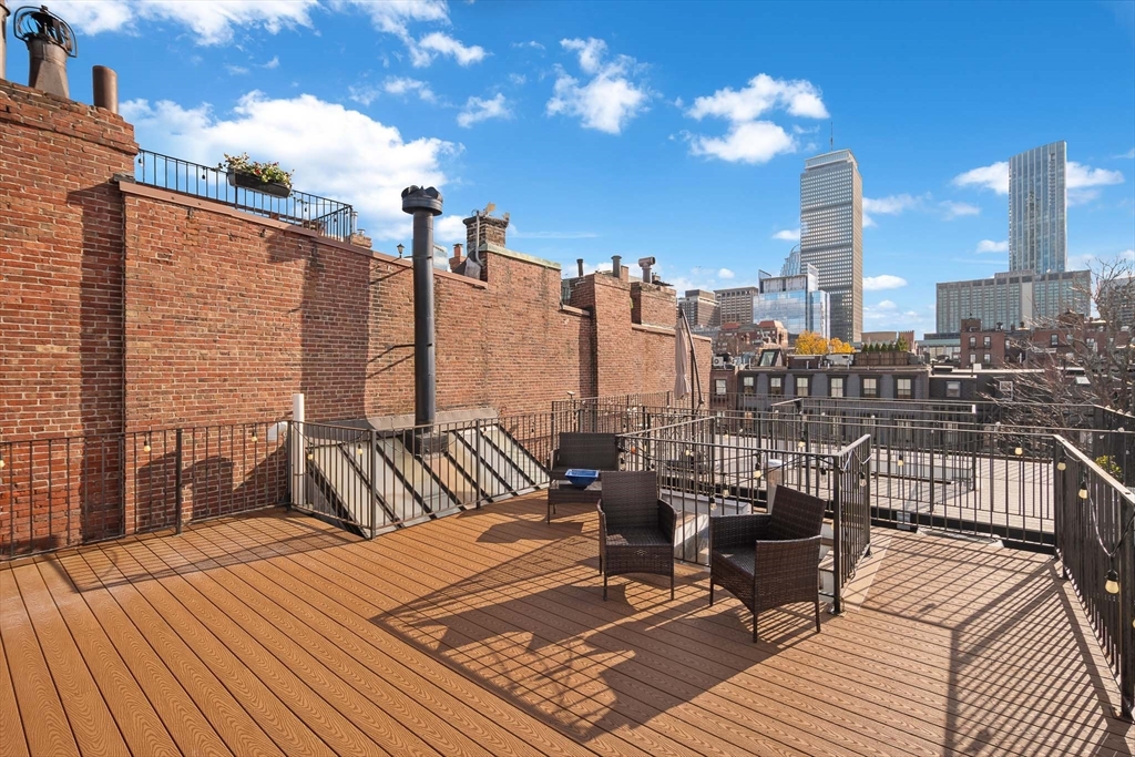 413 Beacon Street, Unit 5 Boston, MA 02115 - Photo 15 of 19 a view of a terrace with seating area
