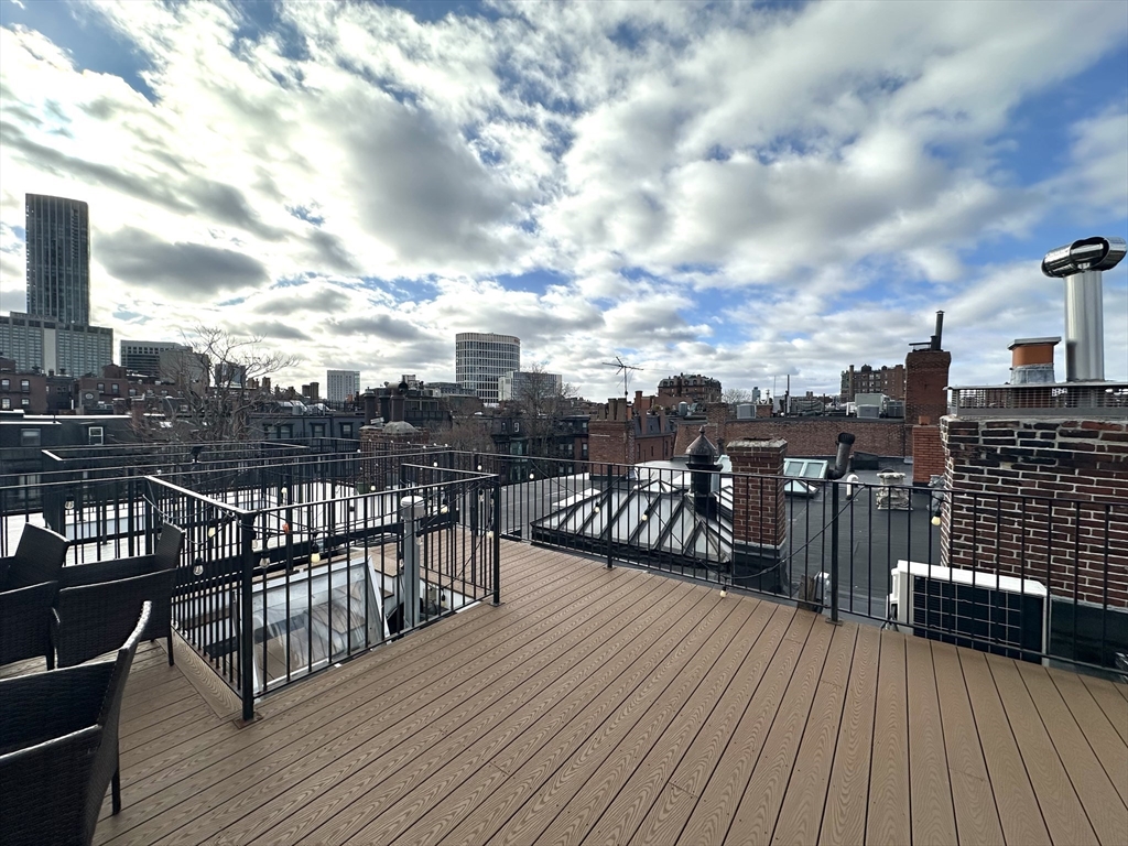 413 Beacon Street, Unit 5 Boston, MA 02115 - Photo 16 of 19 a view of a balcony with wooden floor