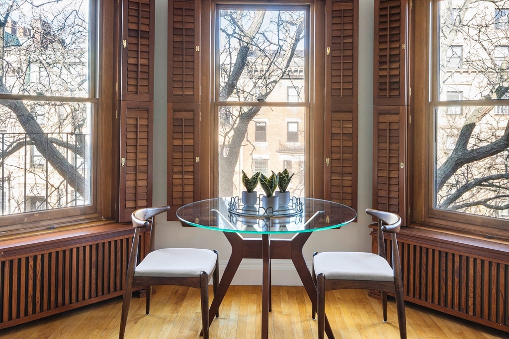 413 Beacon Street, Unit 5 Boston, MA 02115 - Photo 3 of 19 a view of a dining room with furniture and a window