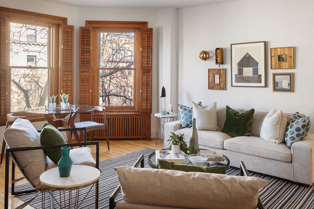 413 Beacon Street, Unit 5 Boston, MA 02115 - Photo 4 of 19 a living room with furniture and a large window