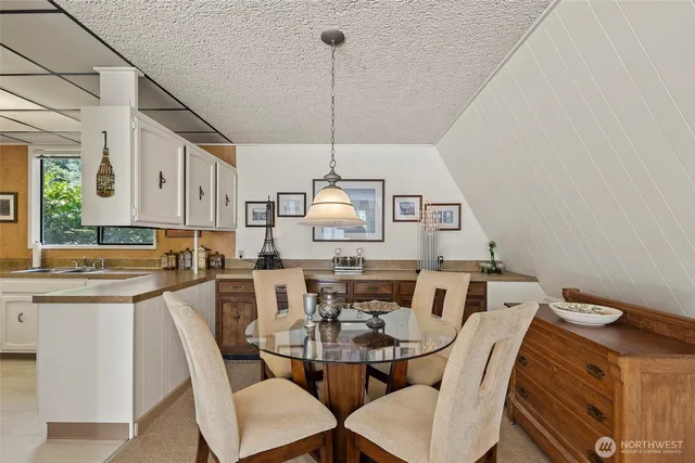 a kitchen with sink cabinets and stove