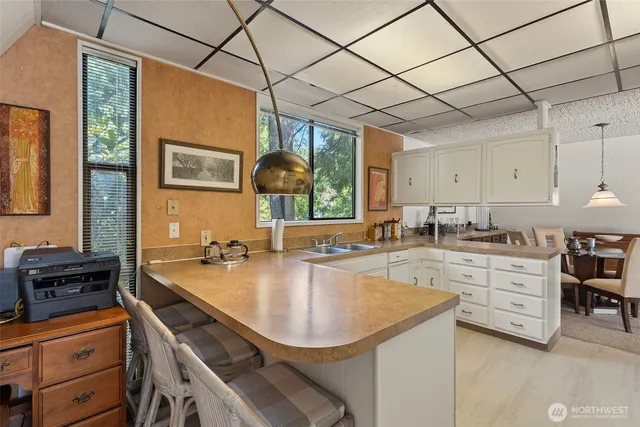 a kitchen with a sink and a window