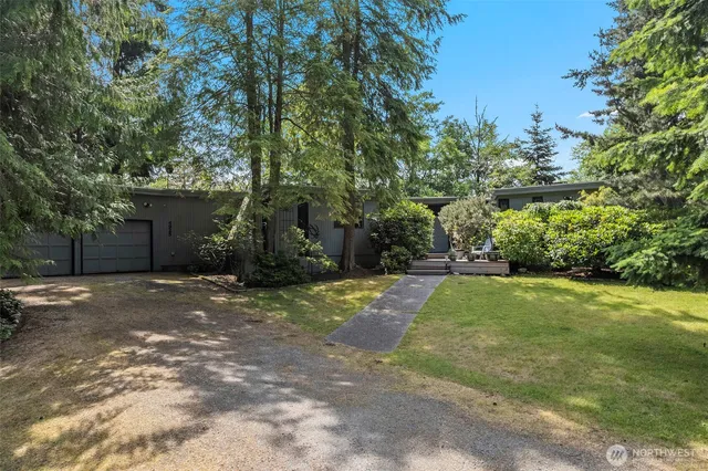a backyard of a house with lots of green space