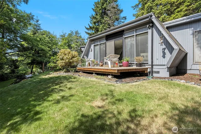 a front view of house with yard having outdoor seating