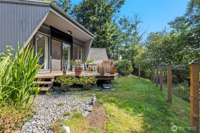 a backyard of a house with seating space
